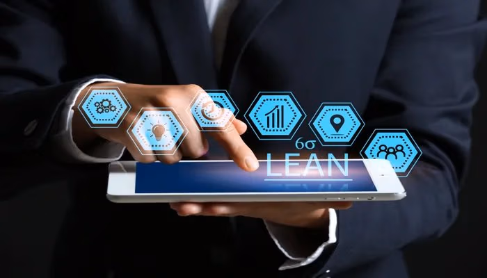 Tablet displaying lean manufacturing software icons for process optimization.