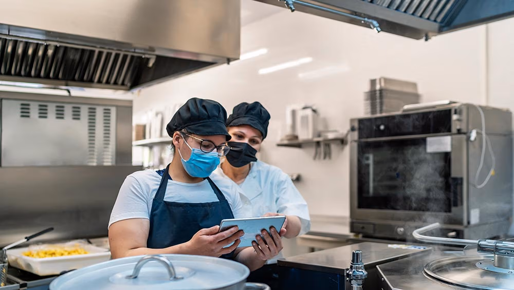 hygienic inspection restaurant kitchen with iPad