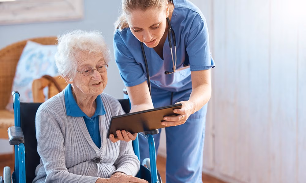 nursing visit and showing medication with her iPad to the patient