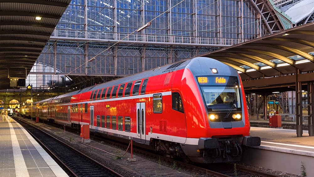 train is driving in a main Train station